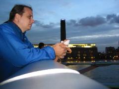 On the Millenium Bridge in London, with a view of the Tate Modern.